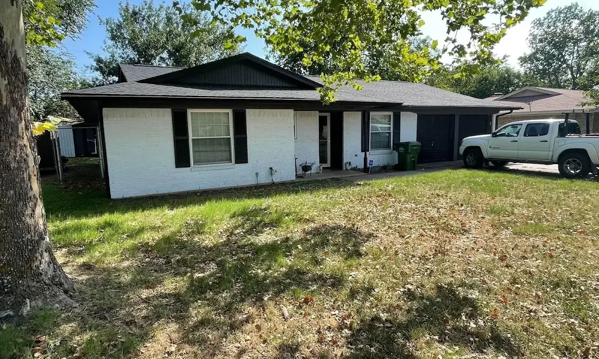 Professional roofing crew working on a residential roof in Haddon Heights